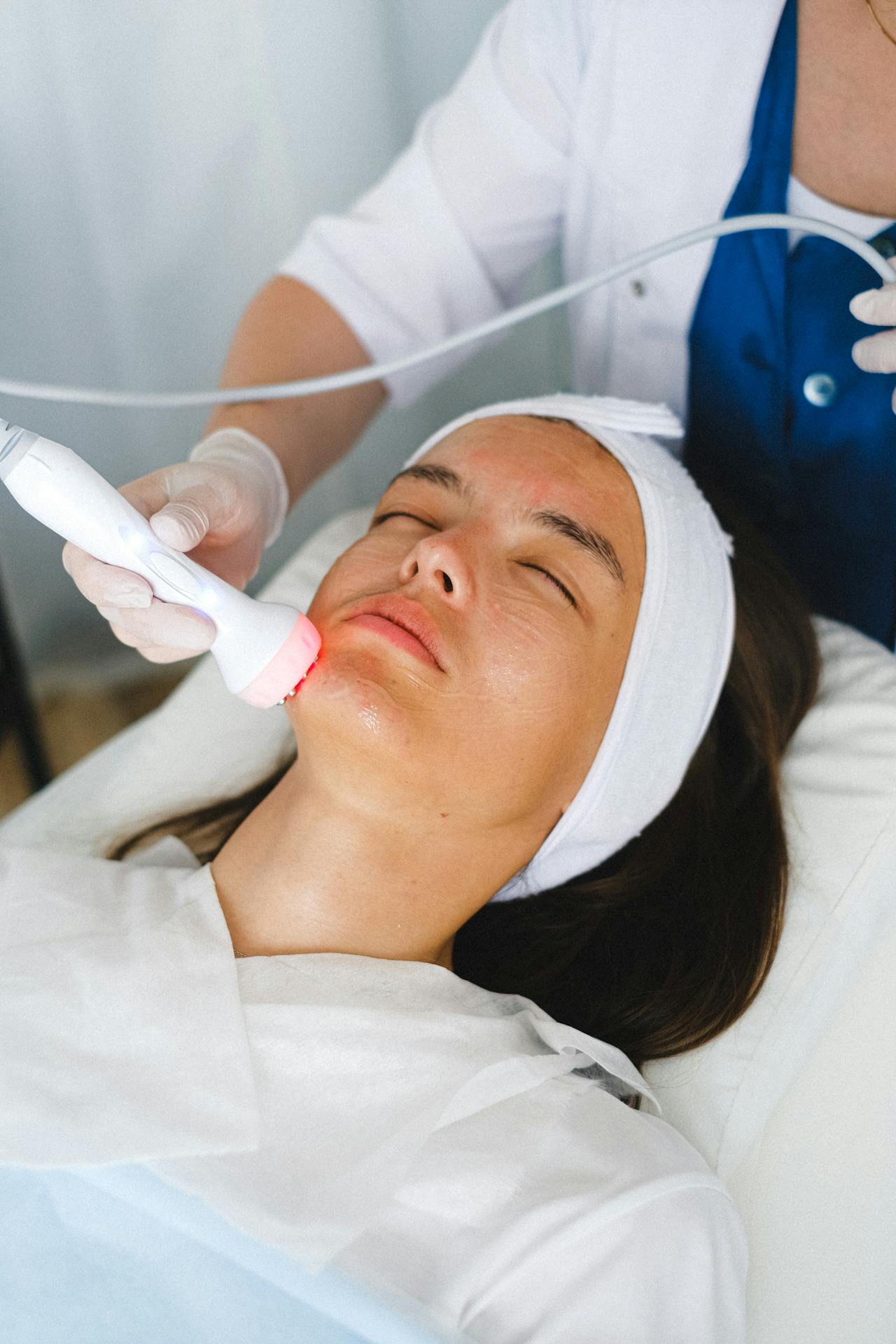 woman at med spa receiving infrared light treatment for anti-aginng